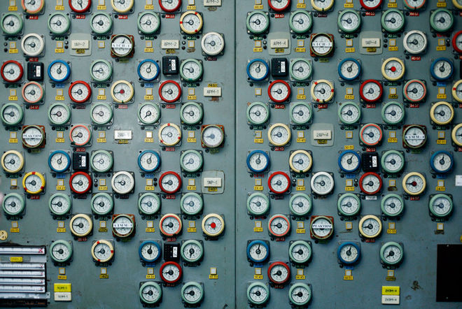A wall of dials in the 1st Block Control Room once indicated levels for each of the rods in the reactor. Although the plant stopped producing electricity in 2000, nuclear fuel remains stored in three reactor halls. Photo: Michael Forster Rothbart.